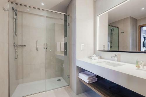 a bathroom with a shower and a sink at Hilton Garden Inn Casablanca Sud in Casablanca