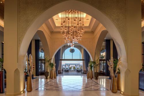 a chandelier in the lobby of a hotel at Hilton Tangier Al Houara Resort & Spa in Al Houara
