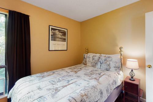 a bedroom with a bed and a picture on the wall at Hillcrest Haven in Banner Elk