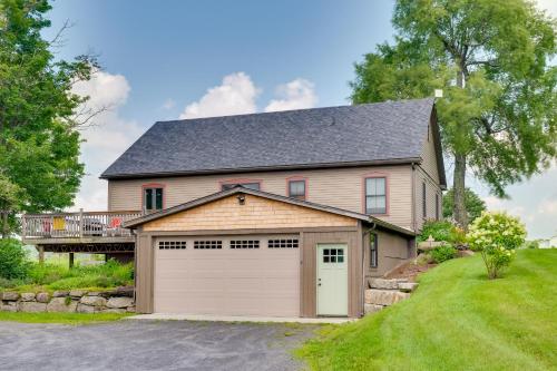 a large house with a garage at On-Site VAST Hiking Trail Hardwick Farmhouse! in Hardwick