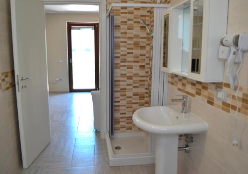 a bathroom with a sink and a mirror at Agriturismo I 3 Fratelli in Sala Consilina