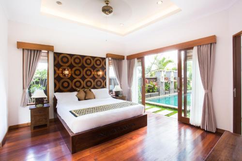 Voodi või voodid majutusasutuse Villa DK - Bali toas