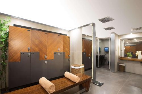 a bathroom with two lockers and a bench at DoubleTree By Hilton Istanbul - Old Town in Istanbul