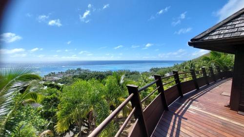 a balcony with a view of the ocean at Villa Honu - Legends Residences - Stunning Ocean Views in Papetoai