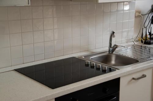 a kitchen with a sink and a counter top at Relais del Marchese in Turi