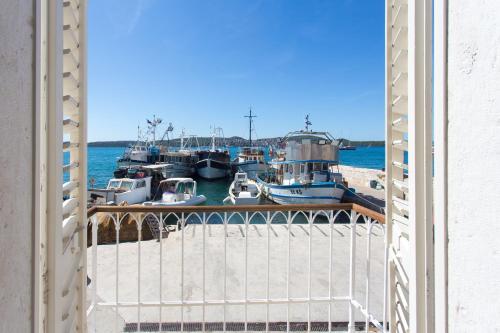a group of boats are docked at a marina at Heritage Art Home in Trogir