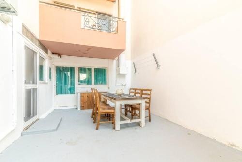 a table and chairs on the patio of a house at The Holiday Choice 1 in Agios Nikolaos