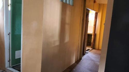 a hallway of a room with a wall at BNJ Boarding House in Bislig