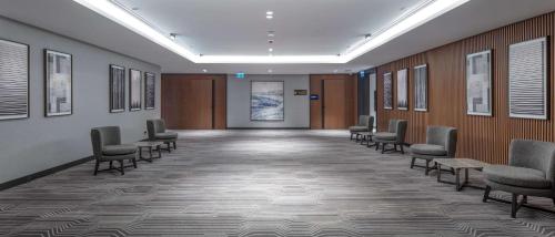 a waiting room with chairs and a corridor at Doubletree By Hilton Canakkale in Canakkale