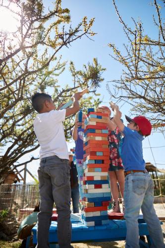 a group of children playing with blocks on a trampoline at Casa Pavo Real en el Viñedo El Pavo Real del Campo in San Miguel de Allende