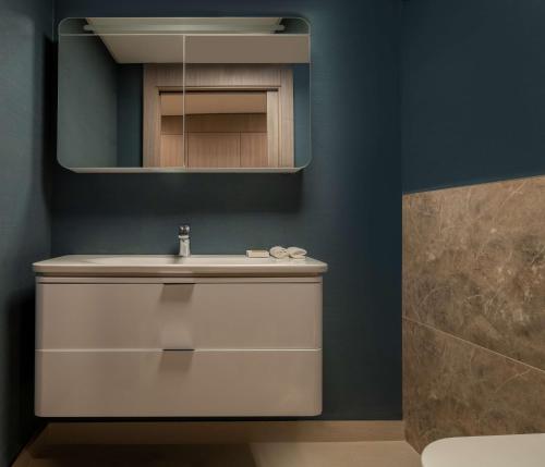 a bathroom with a sink and a mirror at Hilton Mall Of Istanbul in Istanbul