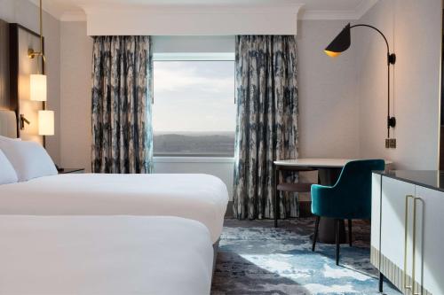 Ένα ή περισσότερα κρεβάτια σε δωμάτιο στο Hilton Glasgow