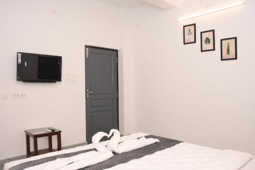 Sizzling Inn Pondyにあるベッド