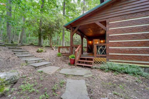 a log cabin with steps leading to a porch at Family-Friendly Blue Ridge Cabin with Game Room! in Fleetwood