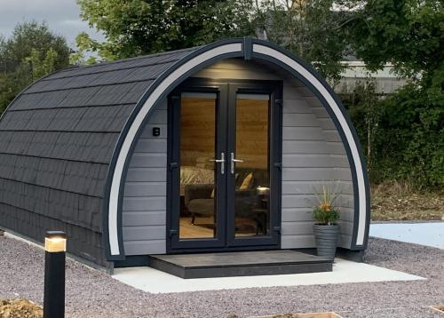 a large dome shaped shed with a door at Gateway Glamping in Farranfore