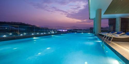 a large swimming pool on the roof of a building at DoubleTree by Hilton Hotel Guangzhou-Science City-Free Shuttle Bus to Canton Fair Complex and Dining Offer in Guangzhou