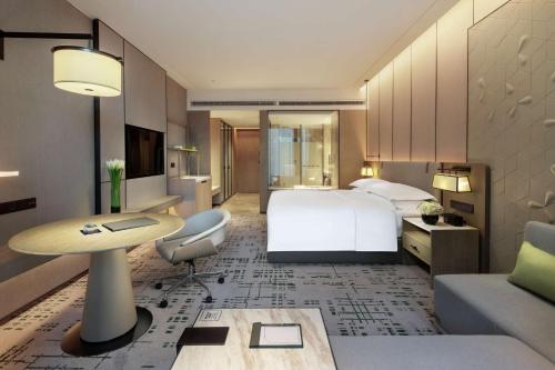 Ένα ή περισσότερα κρεβάτια σε δωμάτιο στο Hilton Chengdu Chenghua - Close to Panda Base and Chunxi Road