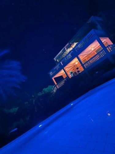 a building at night with lights on it at Dar Bakkali Nadi in Tangier