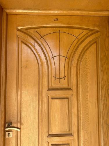 a wooden door with a design on it at Marina saidia luxury Duplex pool & garden view in Saidia 