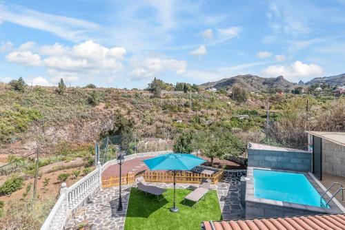 an aerial view of the backyard of a house with a pool at Raíces Vivas Vivienda Vacacional in Vega de San Mateo