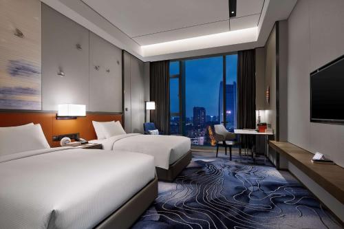 Katil atau katil-katil dalam bilik di Hilton Guiyang
