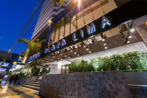 a building with a sign on the side of it at Crowne Plaza Lima by IHG in Lima