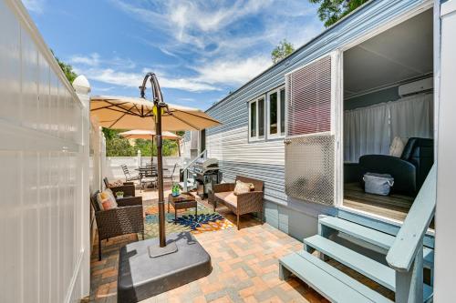 an outdoor patio with a table and an umbrella at Low-Key Poway Home about 20 Mi to La Jolla and San Diego in Poway