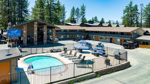 a hotel with a swimming pool and a resort at Blue Jay Lodge in South Lake Tahoe