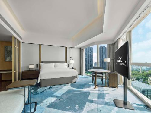 Postel nebo postele na pokoji v ubytování Hilton Foshan Shunde - Free Shuttle Bus to Canton Fair