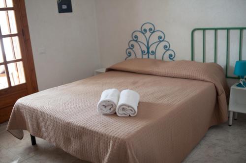 Ein Bett oder Betten in einem Zimmer der Unterkunft Lisca Bianca Tropea