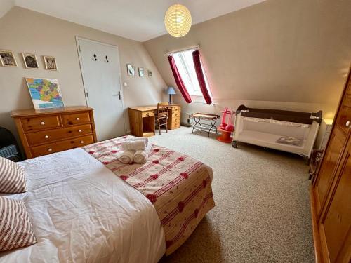 Ένα ή περισσότερα κρεβάτια σε δωμάτιο στο La Maison Cachée