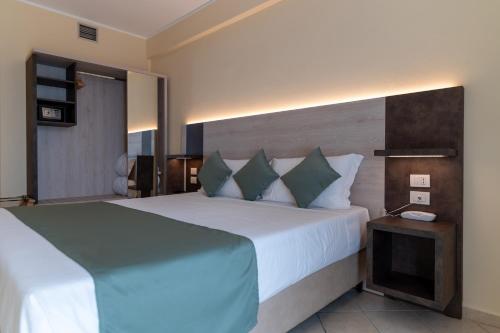 a bedroom with a large bed and a television at Villa Cesi Resort & Spa in Impruneta