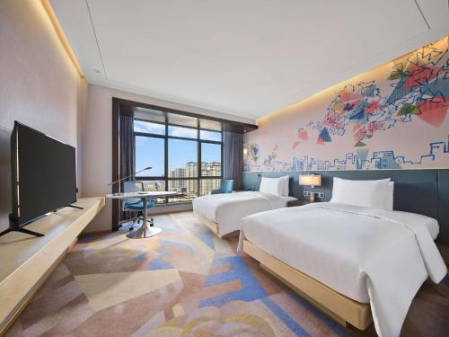 Ένα ή περισσότερα κρεβάτια σε δωμάτιο στο Hilton Garden Inn Heze