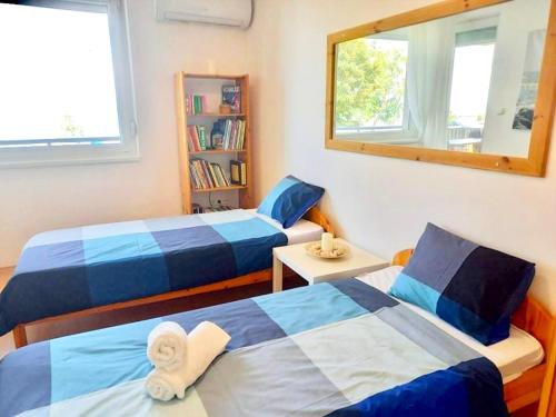 Katil atau katil-katil dalam bilik di Balaton BeachSide Apartman Siófok N1