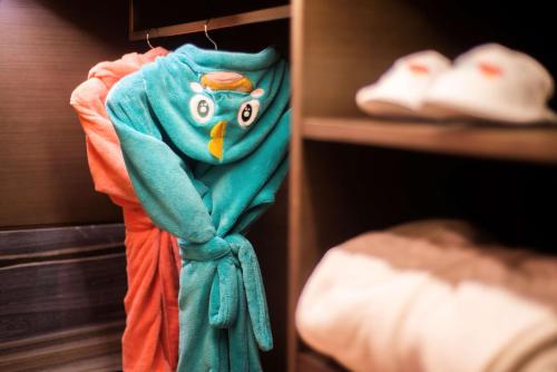 a blue towel is hanging on a closet at Hilton Jinan South Hotel & Residences in Jinan