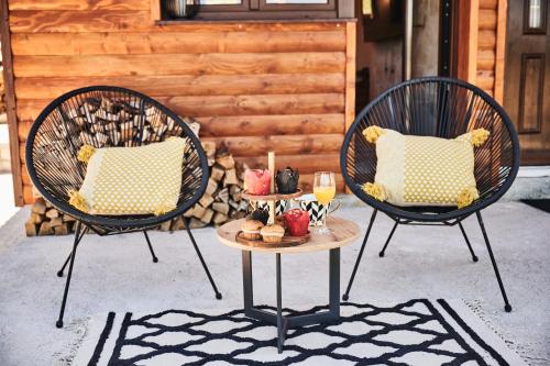 two chairs and a table with drinks on a patio at MoMa Escape in Borje
