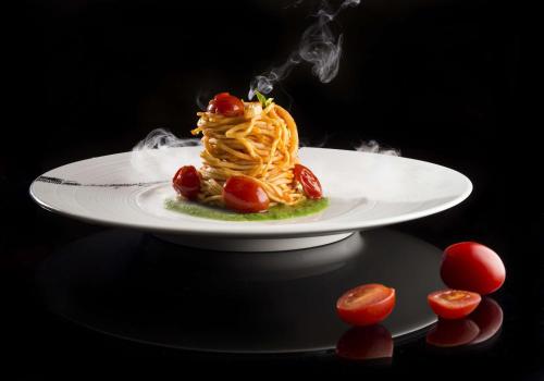 a dessert on a white plate on a table at Hilton Zhengzhou in Zhengzhou
