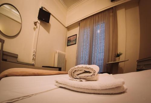Postel nebo postele na pokoji v ubytování Hotel King Pyrros