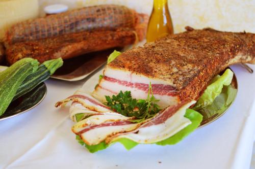 a sandwich on a plate on a table at Agriturismo Terra Di Elea azienda agricola di Raimondo MIchela in Ascea