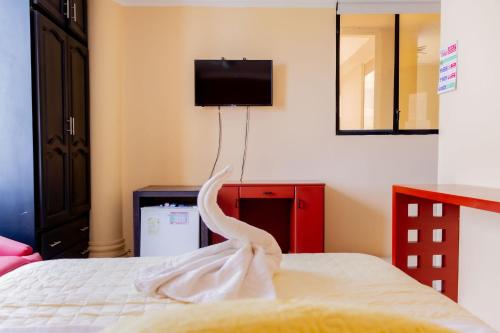 Postel nebo postele na pokoji v ubytování Hostal Antares