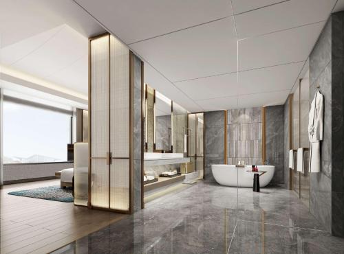 La salle de bains est pourvue d'une baignoire et d'un lavabo. dans l'établissement DoubleTree by Hilton Jiangxi Fuzhou, à Fuzhou