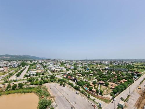 an aerial view of a city with a river at Three Bed Attached Bath Netflix Wifi Smart TV Parking WFH Desk Near Airport in Islamabad