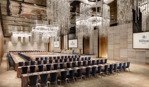 a large hall with chairs and chandeliers at Hilton Pattaya in Pattaya Central