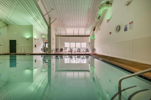 an empty swimming pool in a gymnasium at Charming Hedgesville Retreat with Deck and Fireplace! in Hedgesville