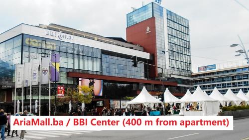 un grupo de tiendas de campaña frente a un edificio en Swiss Central Luxury Apartment 132m2, en Sarajevo