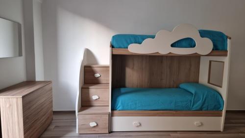 a bunk bed with a cloud bunk bed in a room at Uccio e Gina in Soleto