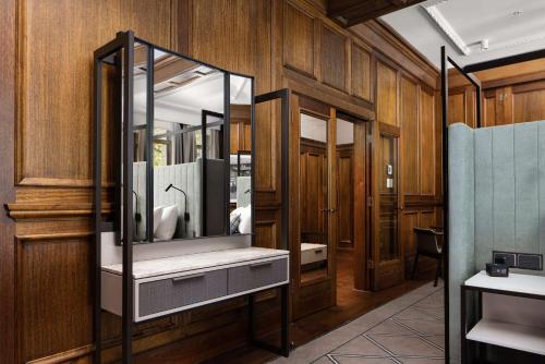 a bathroom with a sink and a mirror at Hilton Melbourne Little Queen Street in Melbourne