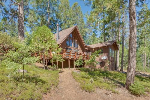a log home in the woods with a path leading to it at 6 Mi to Yosemite Natl Park 14-Acre Retreat! in Groveland