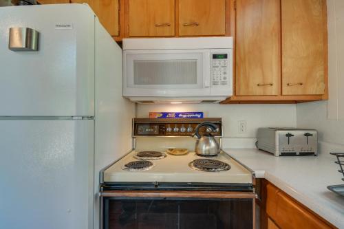 a kitchen with a stove and a microwave at 6 Mi to Yosemite Natl Park 14-Acre Retreat! in Groveland