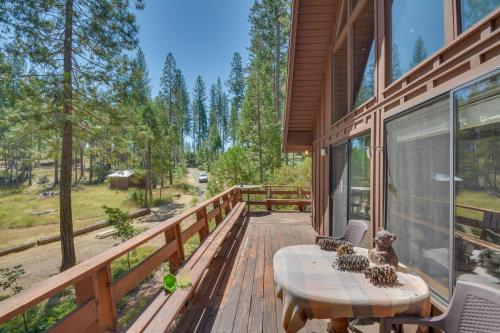 a deck with a table and chairs on a house at 6 Mi to Yosemite Natl Park 14-Acre Retreat! in Groveland
